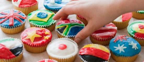 "Kwint-vision" diversity videos and culture quizzes Cupcakes decorated with world flags